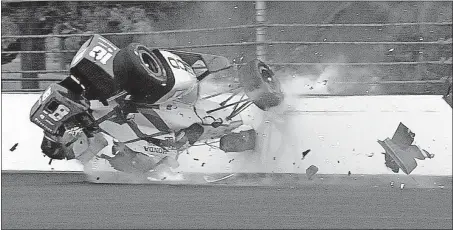  ?? [GREG HUEY/THE ASSOCIATED PRESS] ?? Sebastien Bourdais’ car flips after hitting wall in the second turn during qualifying Saturday. Bourdais suffered multiple pelvis fractures and a fractured hip.