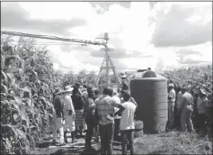  ??  ?? Farmers who received irrigation centre pivots are taught how to use the equipment in Umguza District recently