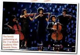 ??  ?? The family performing at the 71st British Academy Film Awards Show.