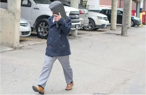  ?? KAYLE NEIS ?? Former teacher Rhett Lundgren walks out of court in Saskatoon on Friday after pleading guilty to several child pornograph­y charges.