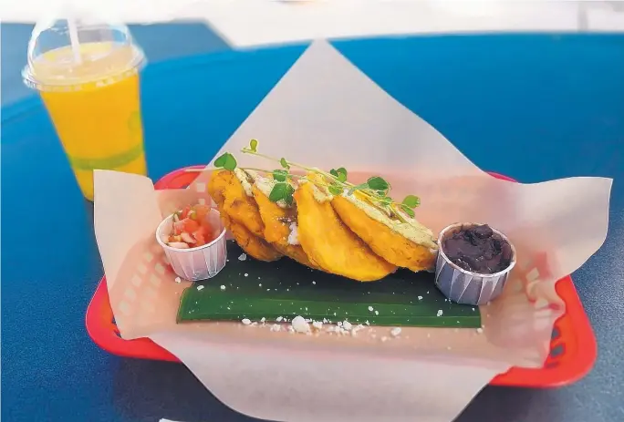  ?? RICHARD S. DARGAN/FOR THE JOURNAL ?? Patacones at Buen Provecho are made from unripe plantains sliced and fried and then mashed and fried again.