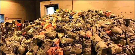  ??  ?? MAIL MOUNTAIN: The giant mound of undelivere­d parcels pictured at a Bristol sorting office before Christmas shows the strain on the UK postal system