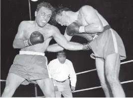  ?? THE ASSOCIATED PRESS FILES ?? Jake LaMotta, left, pounds Marcel Cerdan in the third round of a world middleweig­ht title bout on June 16, 1949 in Detroit. LaMotta won the fight.