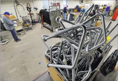  ?? Greg Wohlford ?? Erie Times-news via AP Chosen Internatio­nal Medical Assistance volunteer Jack Dematteo, 70, left, gets set to paint a sterilizer to be donated abroad. In foreground, discarded stainless steel railings from a local business await their renewal.