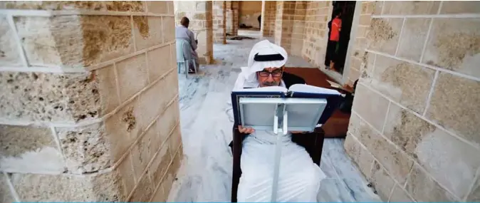  ??  ?? GAZA: A Palestinia­n man reads the Quran at the Al-Omari mosque in Gaza City, on the second day of the Muslim holy fasting month of Ramadan. —AFP