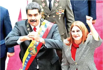  ??  ?? File photo shows Maduro and his wife Cilia Flores arrive at the Congress for the inaugurati­on ceremony in Caracas. — AFP photo