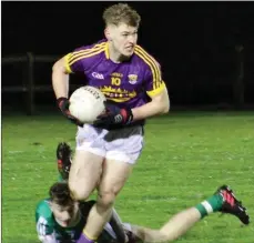  ??  ?? Jake Firman breaks away from a grounded Offaly opponent.