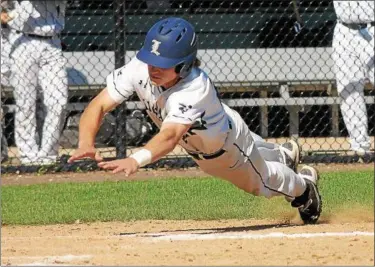  ?? GENE WALSH — DIGITAL FIRST MEDIA ?? La Salle’s Andrew Miles dives into home head first for a run Tuesday in the PIAA 6A semifinals.