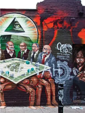  ??  ?? Anti-Semitic: The bankers mural praised by Jeremy Corbyn