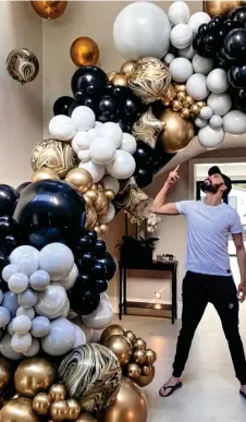  ?? ?? Airway to heaven: TV host Rylan Clark marks turning 33 with this sweep of balloons worth around £350