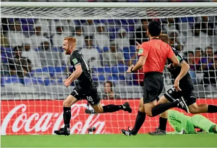  ??  ?? Team Wellington midfielder Aaron Clapham celebrates his goal that put his side 2-0 up against Al Ain in the Club World Cup first-round playoff.