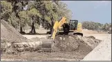  ?? GARRY SMITS/FLORIDA TIMES-UNION ?? A heavy-equipment operator moves earth during a constructi­on project.