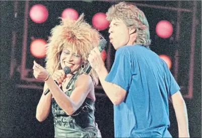  ??  ?? Tina Turner and Mick Jagger perform during Live Aid in Philadelph­ia July 13, 1985