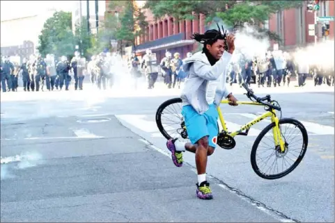  ?? AFP ?? Trump struck a martial tone in a nationwide address from the White House garden, as police fired tear gas on peaceful protesters outside the fence.