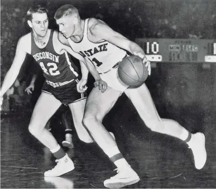  ?? COLUMBUS DISPATCH FILE PHOTO ?? Before Frank Howard (11) made his name as a power hitter in baseball, he was a fine power forward for Ohio State in the 1950s, averaging 17.4 points and 13.9 rebounds in three seasons as a starter.