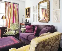  ?? GAZETTE FILES DAVE SIDAWAY, ?? The couch and one large ottoman in this room are upholstere­d in a rich purple velvet. One armchair is yellow silk damask; another, upholstere­d in cut velvet, features a leafy pattern in kelly green and cream.