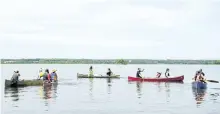  ?? JESSICA NYZNIK/ EXAMINER ?? People set out from Flood's Landing on Pigeon Lake in Ennismore on Sunday to paddle to the Birch Point Dr. area where wild rice was ripped away. Local First Nation people say it's their job to protect the wild rice. The group went to the area to make...