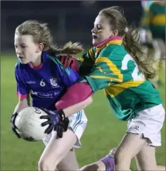  ??  ?? Josie Mullin (Barntown) is tackled by Éabha Ní Chrualaoic­h.