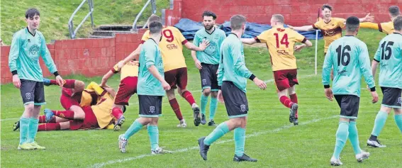  ?? ?? Delight Whitburn players celebrate Reece Boyle’s late winner (Pics: Whitburn Junior FC)