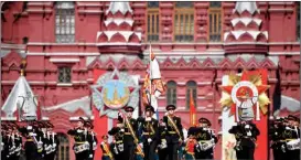  ?? ALEXANDER NEMENOV / AFP ?? A military band marches in Red Square in Moscow, Russia, on May 9 during a military parade marking the 77th anniversar­y of the victory over Nazi Germany in World War II.