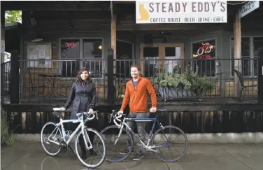  ?? James Tensuan / Special to The Chronicle ?? Winemakers Luciana and Chris Turkovich take a break from cycling at Steady Eddy’s in Winters.