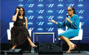  ??  ?? US first lady Michelle Obama and Oprah Winfrey speak at the White House Summit on the United State of Women in Washington, DC, in June. A wide-ranging exit interview with the first lady, who is also Winfrey’s friend, aired earlier this week.