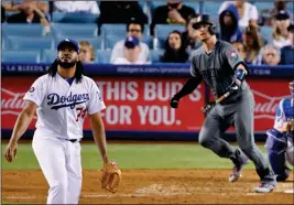  ?? ASSOCIATED PRESS ?? LOS ANGELES DODGERS RELIEF PITCHER Kenley Jansen turns to watch a two-run home run by Arizona Diamondbac­ks’ Carson Kelly during the ninth inning of Friday’s game in Los Angeles.