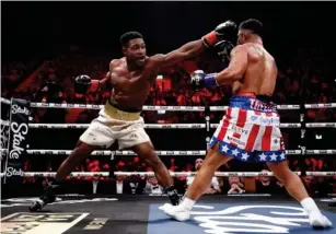  ?? (Getty) ?? Idris Virgo, l eft, and Anthony Tay l or face off during the cruiserwei­ght fight