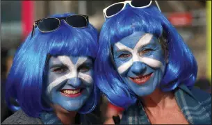  ??  ?? Star-cross’d Saltires: Nobody showed more support than these true blue fans