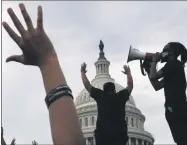  ?? JACQUELYN MARTIN—ASSOCIATED PRESS ?? In this June 3, 2020, file photo demonstrat­ors protest the death of George Floyd as they gather on the East side of the U.S. Capitol in Washington. Floyd died after being restrained by Minneapoli­s police officers. The three month stretch between the symbolic kickoff and close of America’s summer has both galvanized broad public support for the racial justice movement and exposed the obstacles to turning that support into concrete political and policy changes.