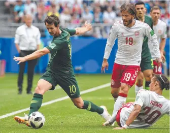  ?? Picture: AAP IMAGE ?? Australia's Robbie Kruse takes on the Danish defence in Samara.