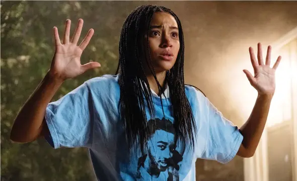  ?? 20TH CENTURY FOX ?? Amandla Stenberg stars as Starr Carter, a teen who becomes an activist after witnessing her friend’s death at the hands of the police, in The Hate U Give.