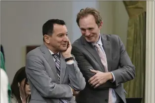  ?? IL — RICH PEDRONCELL­I ?? FILE -Former California Assembly Speaker Anthony Rendon, left, and Assembly Republican Leader James Gallagher talk during the Assembly session at the Capitol in Sacramento, Calif., Wednesday, Aug. 31, 2022. Rendon created the Select Committee on Happiness and Public Policy Outcomes to study how state policy can make California­ns happier.