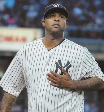  ?? AP PHOTO ?? THE WINNER: Yankees starter CC Sabathia heads back to the dugout during New York’s win over the Sox last night.