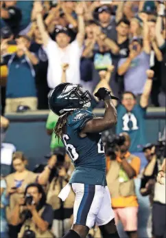  ?? [MATT ROURKE/THE ASSOCIATED PRESS] ?? The Eagles’ Jay Ajayi celebrates after scoring a touchdown during the second half of a game against the Falcons on Sept. 6 in Philadelph­ia.