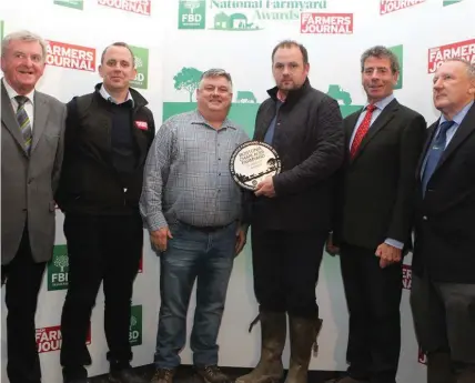  ??  ?? The Feeney Family, Greg Feeney, Darragh McManus from Scurmore, Enniscrone receiving their Farmyard Award.