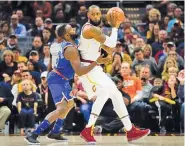  ??  ?? JASON MILLER/GETTY IMAGES Lebron James (R) is closely watched by Tim Hardaway Jr. in Cavaliers’ defeat against Knicks in Cleveland’s Quicken Loans Arena on October 29, 2017.