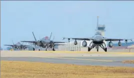  ?? AFP ?? US Air Force F16 Fighting Falcon (right) and F35A Lightning II fighter jets taxiing at Kunsan Air Base in South Korea’s southweste­rn port city of Gunsan.