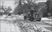  ?? Photos by Matthew Liebenberg/Prairie Post ?? City graders plow snow and ice into windrows along a residentia­l street in Swift Current, March 9.