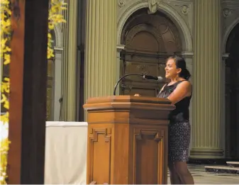  ?? COURTESY OF UNIVERSITY OF SAN FRANCISCO ?? Genevieve Negrón- Gonzales speaks at the University of San Francisco Latino Recognitio­n Ceremony, an annual event where graduating Latino students are recognized for their achievemen­ts in academics, service and leadership. Negrón- Gonzales chairs the...