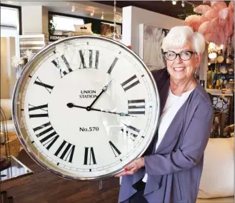  ?? STEVE MacNAULL/The Okanagan Weekend ?? Reminding you to “spring forward” and set your clocks an hour ahead before going to bed tonight is Delores Davis, owner of the home accents store Modern Accents in Kelowna.The switch means you’ll get a hour less sleep unless you have a lie-in past your normal rising time.The actual change to Pacific daylight time from Pacific standard time is at 2 a.m. Sunday. The change means sunrise and sunset will be an hour later tomorrow at 7:22 a.m. and 6:55 p.m., respective­ly.