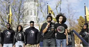  ??  ?? COLUMBIA, Missouri: Jonathan Butler (front left) addresses a crowd following the announceme­nt that University of Missouri System President Tim Wolfe would resign, on Nov 9, 2015. — AP