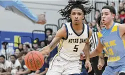  ?? Pete Paguaga/Hearst Connecticu­t Media ?? Notre Dame-Fairfield’s Carmelo Ayala handles the ball against Kolbe Cathedral on Thursday.