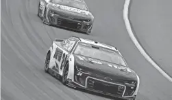  ?? GARY A. VASQUEZ/USA TODAY SPORTS ?? NASCAR Cup Series driver William Byron (24) leads driver Kyle Larson during the Pennzoil 400 at Las Vegas Motor Speedway.