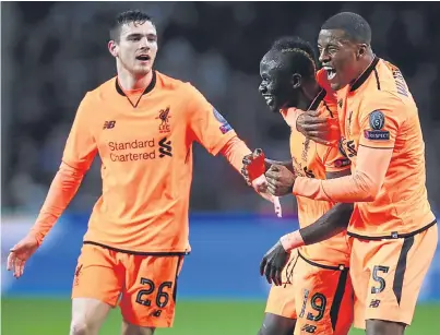  ?? Picture: Getty. ?? Sadio Mane celebrates with Andrew Robertson and Georginio Wijnaldum.