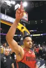  ?? Matthew Stockman / Getty Images ?? CJ McCollum of the Portland Trail Blazers celebrates their 100-96 win over the Denver Nuggets after Game 7 of the Western Conference semifinals at the Pepsi Center on Sunday in Denver.