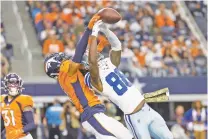  ?? RON JENKINS/ASSOCIATED PRESS FILE PHOTO ?? Broncos cornerback Ronald Darby breaks up a pass intended for the Cowboys’ CeeDee Lamb on Nov. 7 in Arlington, Texas.