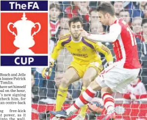  ??  ?? Arsenal French striker Olivier Giroud (R) scores the opening goal during the English FA Cup fifth round football match between Arsenal and Middlesbro­ugh at the Emirates Stadium in London. - AFP photo