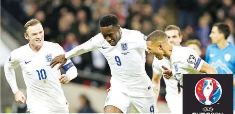  ??  ?? England’s striker Danny Welbeck (C) celebrates after scoring his team’s second goal during the Euro 2016 Qualifier, Group E football match between England and Slovenia at Wembley in north London on November 15, 2014. - AFP photo