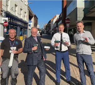  ?? ?? HELPING TO PREVENT CRIME: Rupert Matthews, second left, with Councillor Michael Mullaney, second right, and representa­tives from 24-7 Locks